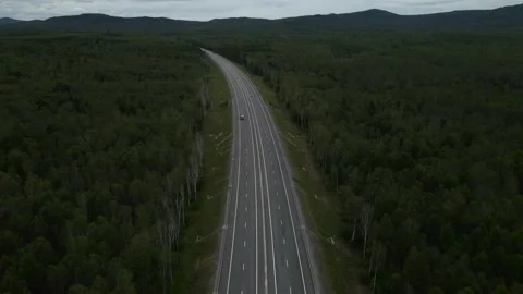 Aerial view of Empty Highway next to Forest, Mountains Range, Vladivostok Stock Footage 163100556