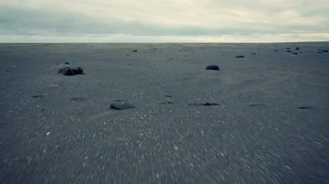 Aerial view of empty Iceland beach with dramatic clouds in background. Stock Footage 48421760