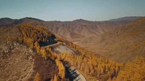 Aerial view of the empty, lonely serpentine mountain road at high altitude Stock Footage 150050986