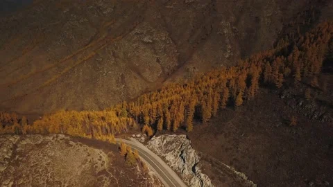 Aerial view of the empty, lonely serpentine mountain road at high altitude Stock Footage 150051396