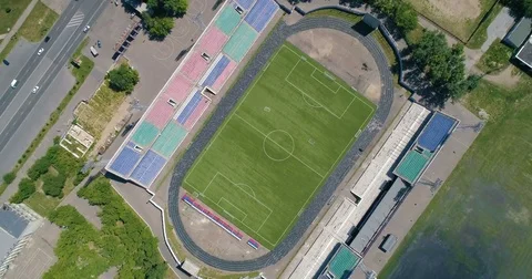 Aerial view of the empty old stadium. Green Football soccer field. Drone footage Stock-Footage 78337267