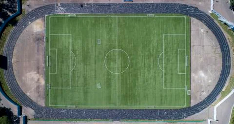 Aerial view of the empty old stadium. Green Football soccer field.  Stock Photos