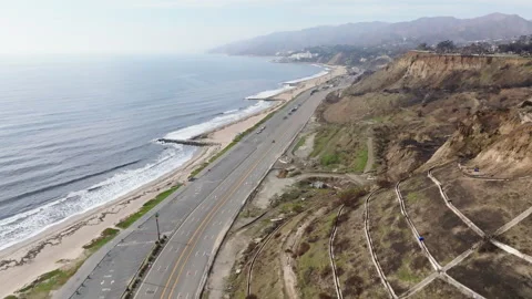 Aerial view of empty Pacific Coast Highway in Pacific Palisades Stock Footage 302389824