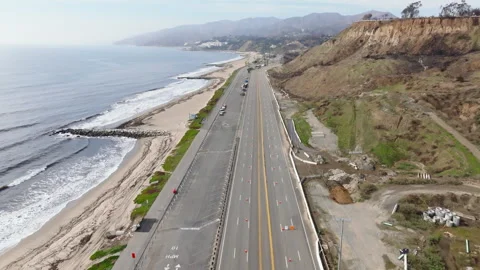 Aerial view of empty Pacific Cost Highway in Pacific Palisades, California Stock Footage 302388329