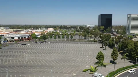 Aerial view of an empty parking lot due to coronavirus pandemic and quarantine Stock Footage 130521475