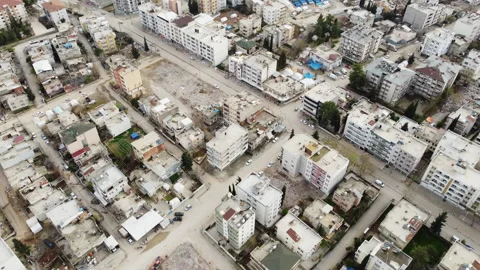 Aerial view of the empty places and debris areas of the houses destroyed Stock Footage 258044854