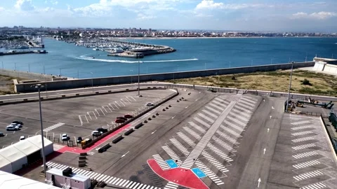 Aerial View of Empty Port Parking Lot and Marina by the Sea on a Sunny Day Stock-Footage 336944128