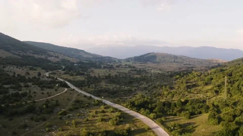 Aerial view of empty road crossing the countryside during sunset, Croatia. Stock Footage 139048125