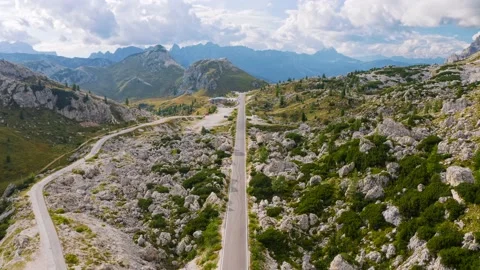 Aerial view of empty road in mountains at sunset in summer Stock Footage 223005637