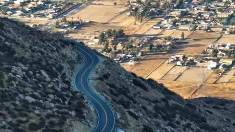 Aerial view of a empty road in the San Bernardino mountains of California Stock Footage 310321025