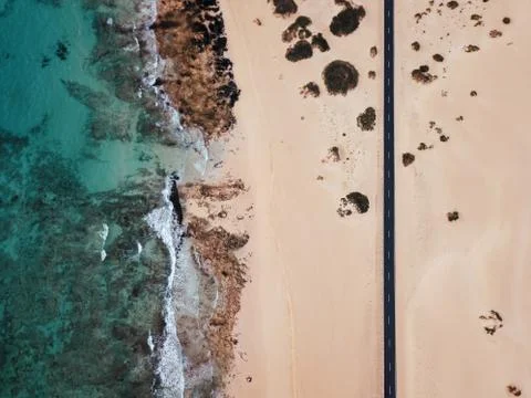 Aerial view of an empty road through the desert Stock Photos