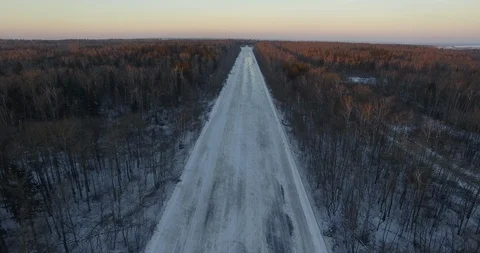Aerial view of empty road in winter woods Video stock 124623062