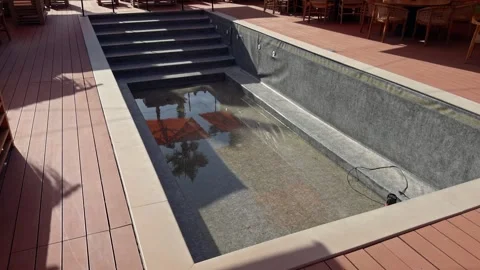 Aerial View of Empty Rooftop Swimming Pool with Wooden Deck Stock Footage 344370856