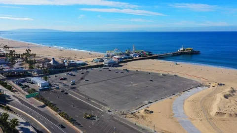 Aerial view of empty Santa Monica pier due to coronavirus pandemic outbreak Stock Footage 127217040