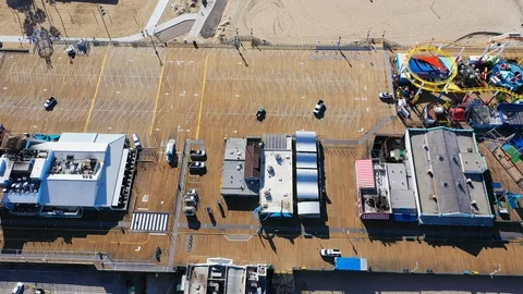 Aerial view of empty Santa Monica pier in Los Angeles due to coronavirus Stock Footage 127217292