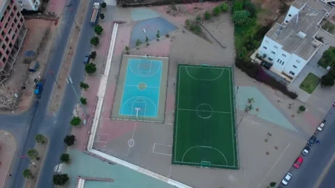 Aerial view of empty soccer and basketball staduim in the street Stock Footage 157316127