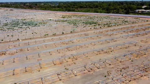 Aerial view of empty solar panel frames for new photovoltaic power plant Stock Footage 291638368