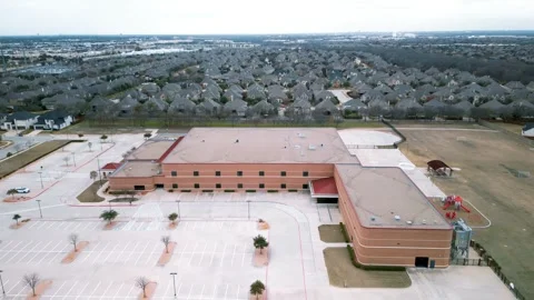 Aerial view of an empty suburban school building Stock Footage 344351306