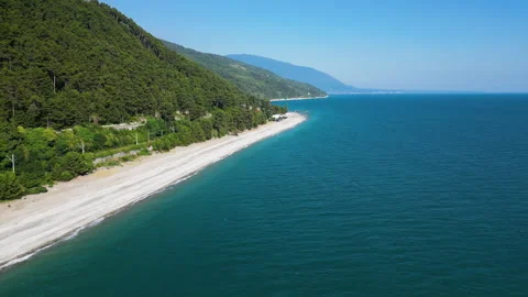 Aerial view of empty tropical beach and blue sea water. Top view of the sea Stock Footage 253055395