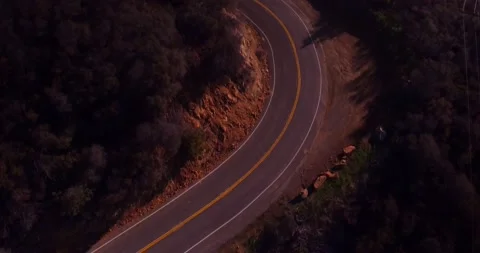 Aerial view of empty winding road in the mountains Stock Footage 136340767