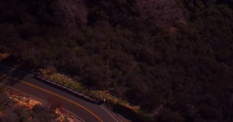 Aerial view of empty winding road in the mountains Stock Footage 136340876