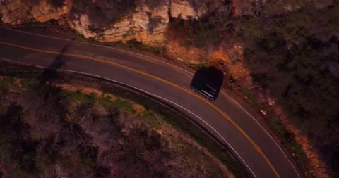 Aerial view of empty winding road in the mountains Stock Footage 136340892