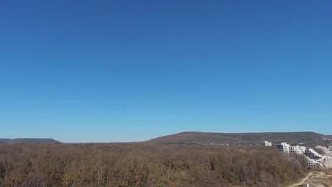 Aerial View of Endless Fields and Distant Horizon Under Clear Sky Stock Footage 324529244