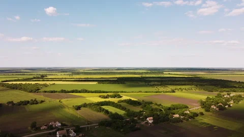 Aerial view of endless lush pastures and farmlands. Beautiful countryside Stock Footage 134838658
