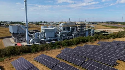 Aerial view of energy facility and solar panels, United Kingdom. Stock Footage 345073252