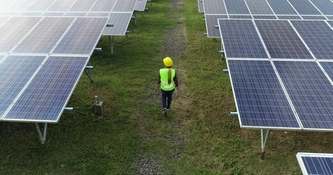 Aerial view of Engineering checking Solar cell Farm, Electricity production Stock Footage 91717059