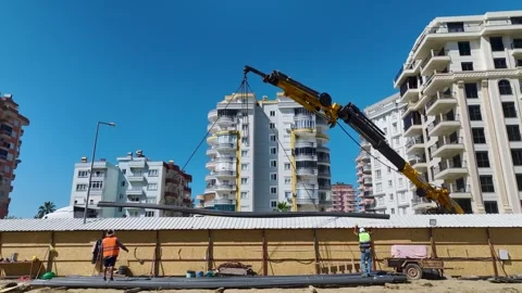 Aerial View: Engineers and builders collaborate to insulate the foundation and Stock Footage 296094736