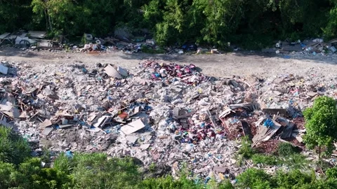 Aerial view of environmental pollution with scattered waste in forest area 스톡 동영상 337999055