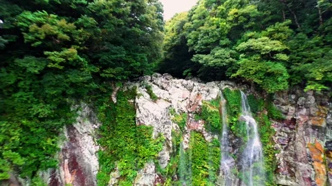 Aerial view of Eongtto Waterfall in Jeju Island, South Korea Stock Footage 296576875