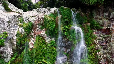 Aerial view of Eongtto Waterfall in Jeju Island, South Korea Stock Footage 296579452