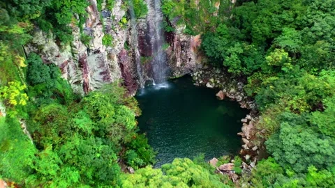 Aerial view of Eongtto Waterfall in Jeju Island, South Korea Stock Footage 296579602