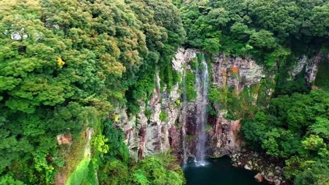 Aerial view of Eongtto Waterfall in Jeju Island, South Korea Stock Footage 296579672