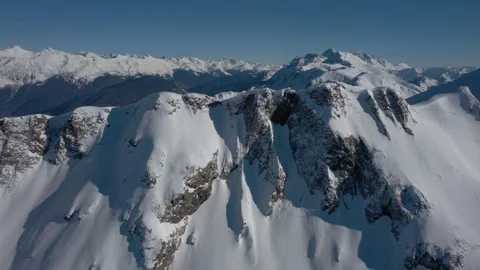 Aerial View. Epic flight over snowy mountain range Stock Footage
