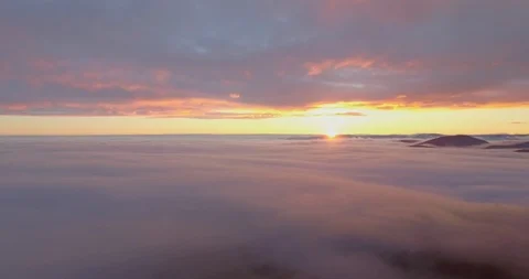 Aerial view of epic low and high clouds at sunset. Between low and high. 4K UHD. Stock Footage 86056561