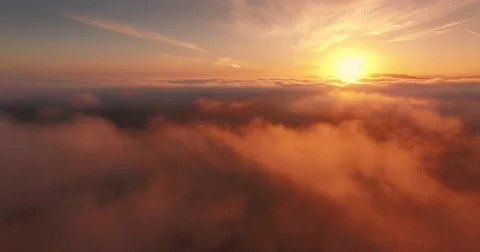 Aerial view epic low clouds over California Pacific Coast sunset flying backward Vidéo 65390780