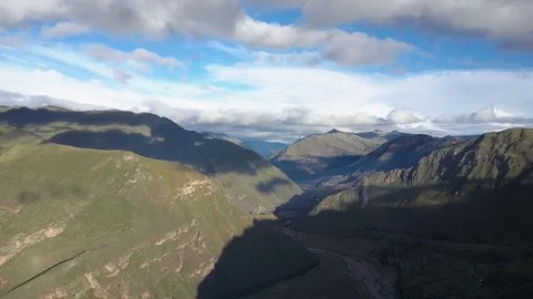 Aerial View of Epic Mountains, Sky, Clouds and River Stock Footage 75748822