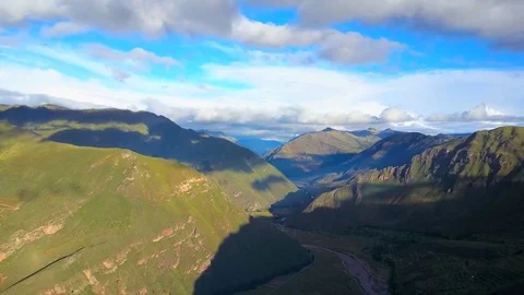 Aerial View of Epic Mountains, Sky, Clouds and River Stock Footage 75748839