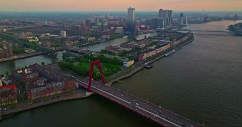 Aerial view of the Erasmus Bridge and island in the center of Rotterdam Stock Footage 276835545
