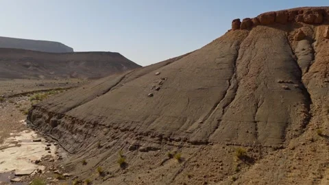 Aerial view of eroded desert cliffs and rocky valley in Morocco Stock-Footage 347693829