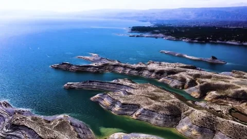 Aerial View of Eroded Landforms in a Vast Lake Landscape China Stock-Footage 346933279