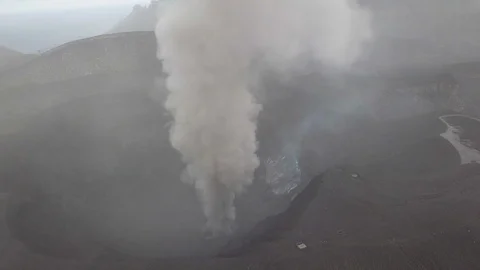 The aerial view of erupting Mt. Aso in Kagoshima, Japan, October 2019. Stock Footage 117278744