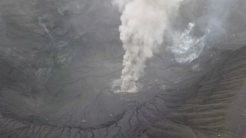 The aerial view of erupting Mt. Aso in Kagoshima, Japan, October 2019. Stock Footage 117279448