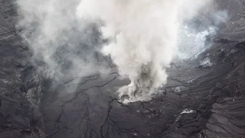 The aerial view of erupting Mt. Aso in Kagoshima, Japan, October 2019. Stock Footage 117279965