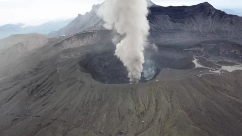 The aerial view of erupting Mt. Aso in Kagoshima, Japan, October 2019. Stock Footage 117280045