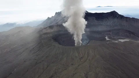 The aerial view of erupting Mt. Aso in Kagoshima, Japan, October 2019. Stock Footage 117280076