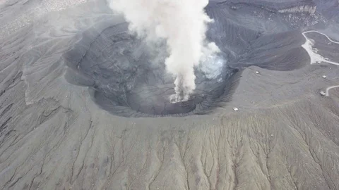 The aerial view of erupting Mt. Aso in Kagoshima, Japan, October 2019. Stock Footage 117280077